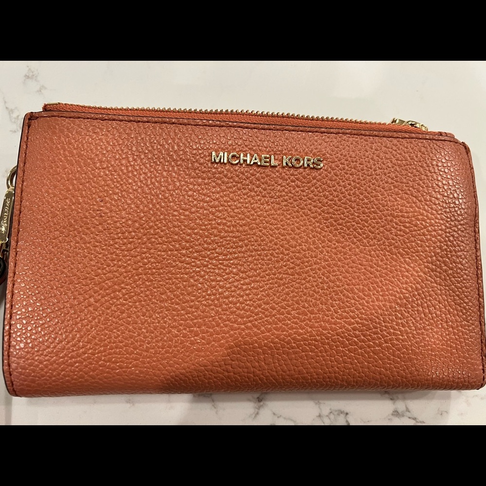 Michael Kors smartphone leather wallet/wristlet. Peachy orange color.